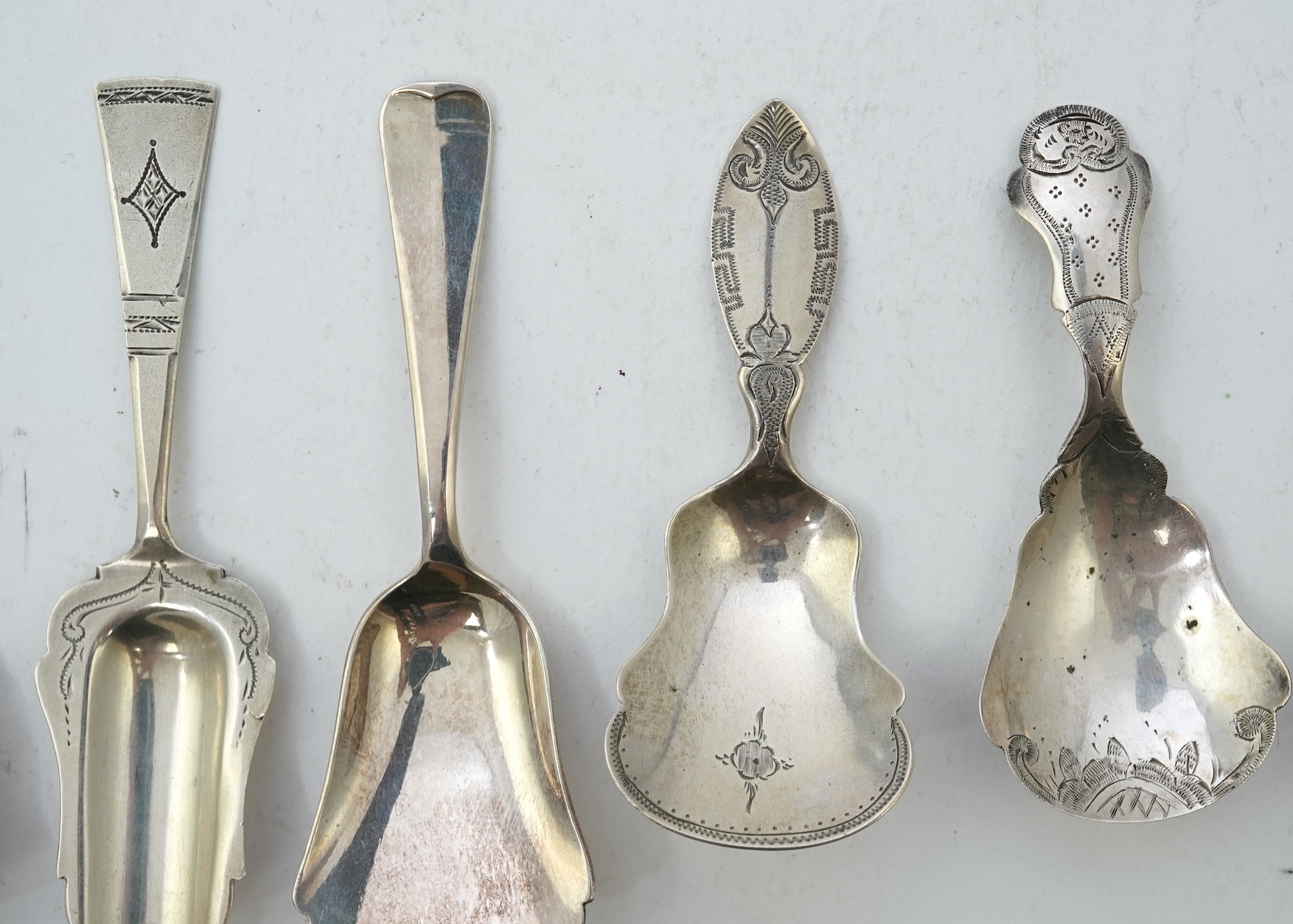 A collection of seventeen mainly 19th century Dutch white metal caddy spoons